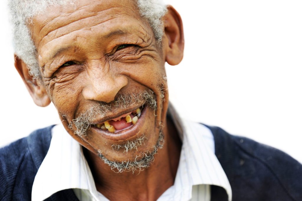 Old man smiling with missing teeth dental implants dentists in Yardley Pennsylvania